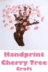 cherry blossom handprint tree - spring tree craft - amorecraftylife.com #craftsforkids #kidscrafts #preschool #spring