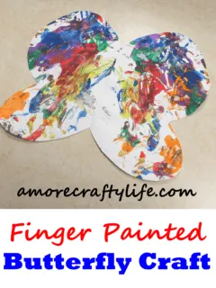 fingerpaint butterfly kid craft - spring kid craft - amorecraftylife.com #kidscraft #craftsforkids #preschool