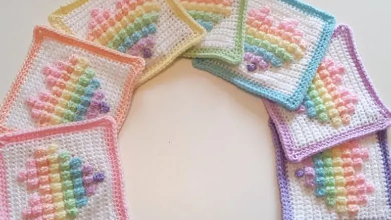 rainbow heart bobble square free crochet pattern - baby blanket crochet pattern - amorecraftlife.com #baby #crochet #crochetpattern #freecrochetpattern