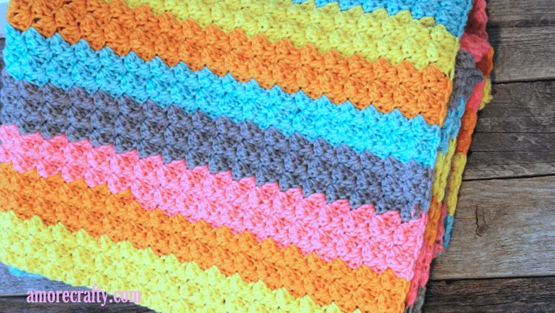 Make an easy and colorful baby blanket with Bernat Pop worsted weight yarn. colorful stripe crochet-baby-blanket-pattern- free printable pdf #crochet #crochetpattern #baby #freecrochetpattern