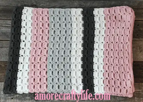 gray pink stripe crochet baby blanket pattern - amorecraftylife.com -feels like butta yarn - baby afghan - free printable crochet pattern #baby #crochet #crochetpattern #freecrochetpattern