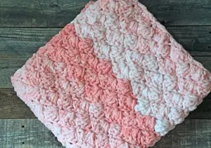 baby girl crochet blanket pattern - amorecraftylife.com -bernat blanket yarn baby blanket - baby afghan - free printable crochet pattern chunky blanket pattern #baby #crochet #crochetpattern #freecrochetpattern
