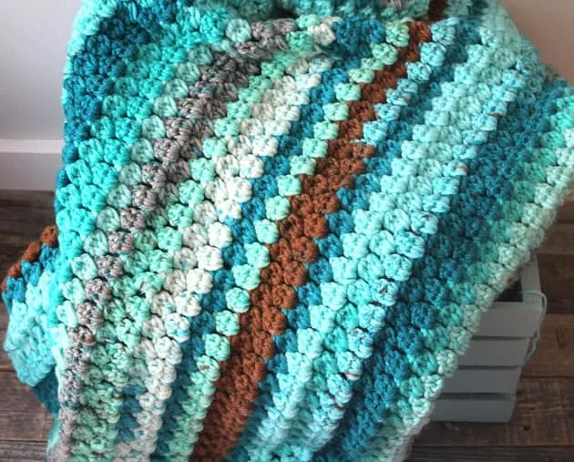 easy chunky blanket free pdf pattern - amorecraftylife.com - baby afghan - bulky yarn - free printable crochet pattern - caron cake yarn #baby #crochet #crochetpattern #freecrochetpattern