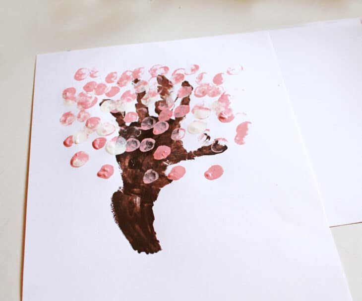 cherry blossom handprint tree - spring tree craft - amorecraftylife.com #craftsforkids #kidscrafts #preschool #spring