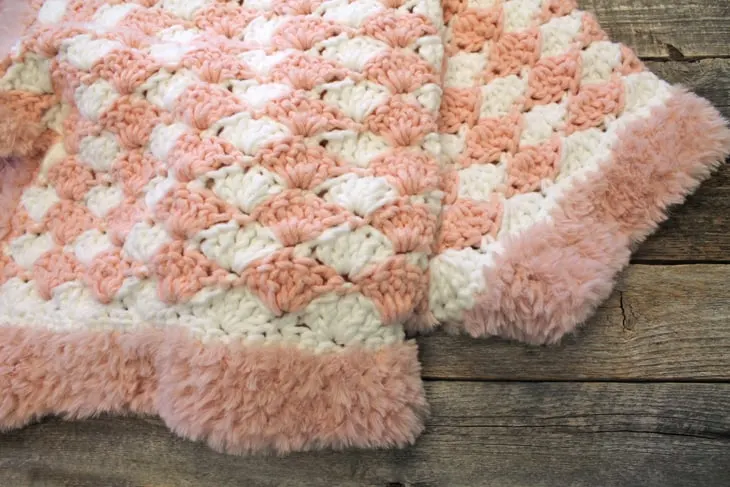 Addison Baby Blanket with Furry Border - baby girl shell crochet blanket pattern - amorecraftylife.com -bernat forever fleece yarn baby blanket - baby afghan - free printable crochet pattern chunky blanket pattern #baby #crochet #crochetpattern #freecrochetpattern