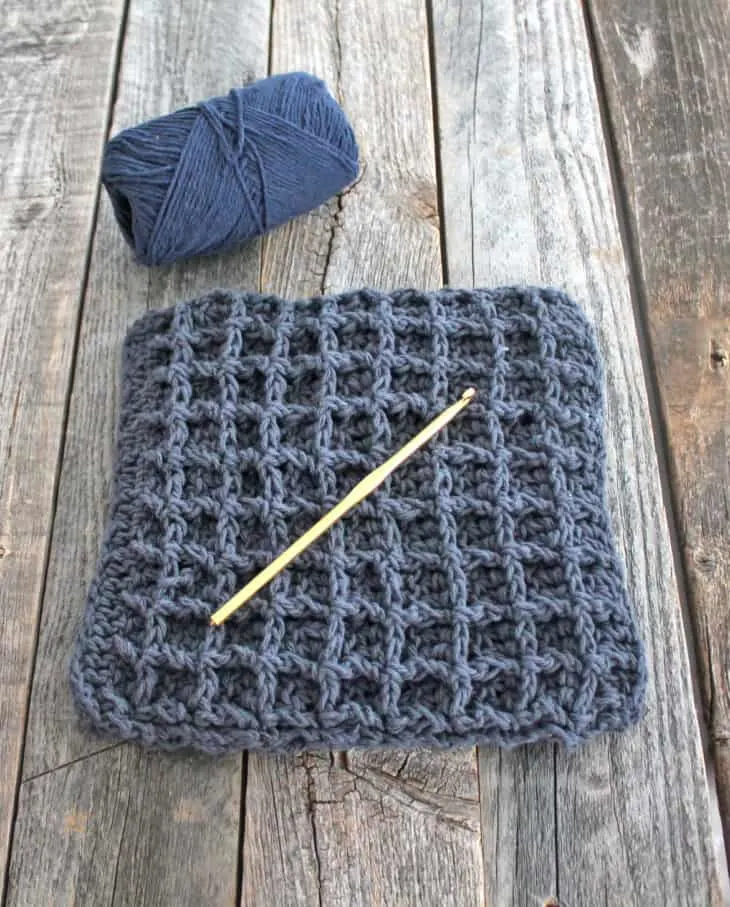 Try this easy waffle stitch potholder. This easy double thick hot pad pattern uses double crochet and front post double crochet to make a squishy box texture. Free PDF available.