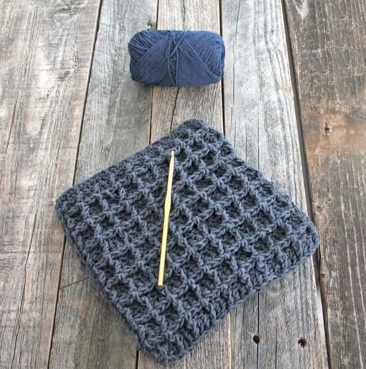 Try this easy waffle stitch potholder. This easy double thick hot pad pattern uses double crochet and front post double crochet to make a squish box texture. Free PDF available.
