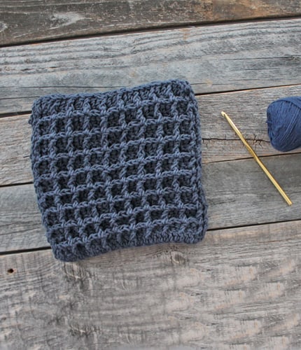 Try this easy waffle stitch potholder. This easy double thick hot pad pattern uses double crochet and front post double crochet to make a squish box texture. Free PDF available.
