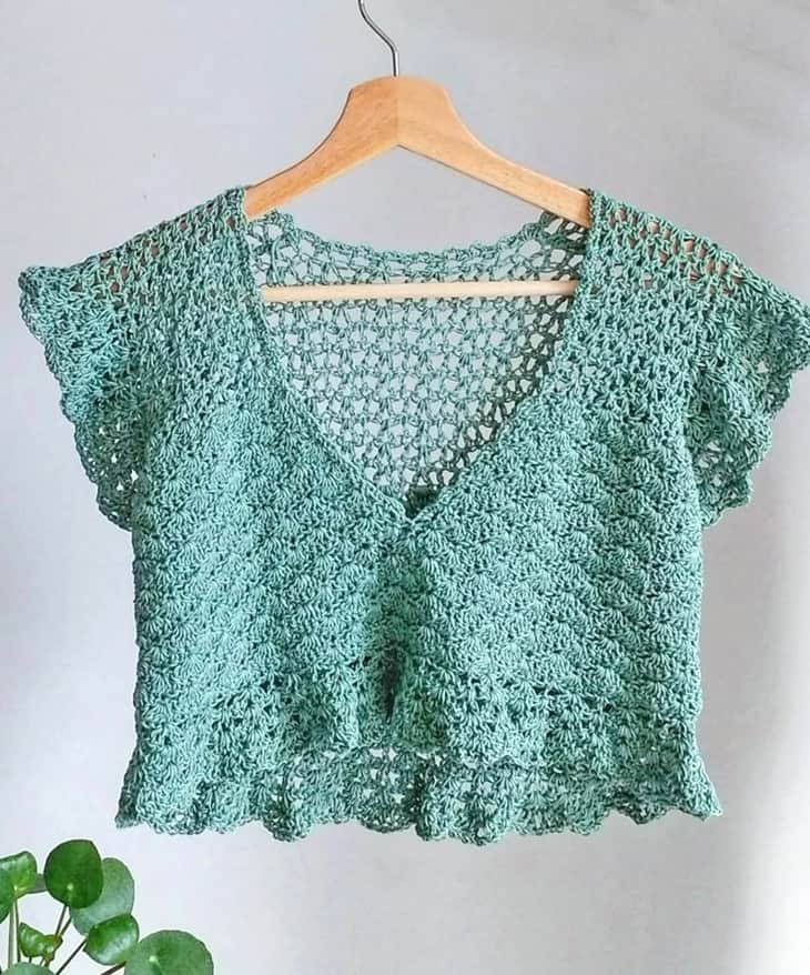 Try some summer crochet top patterns. There are lots of different tops to try.