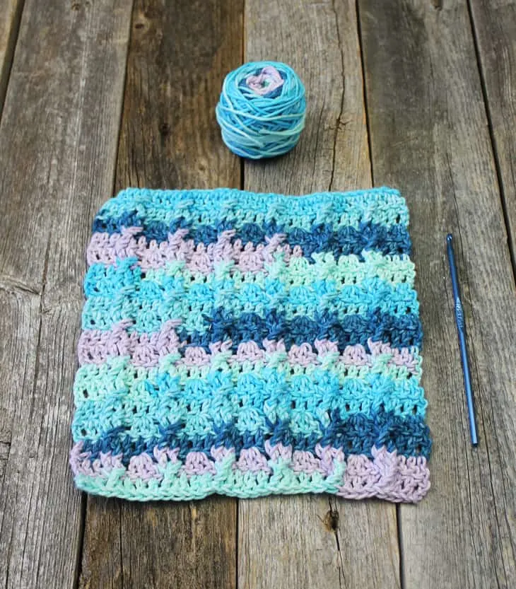 Try this easy mini cable cotton dishcloth pattern. It uses a combination of basic stitches to make this textured pattern.