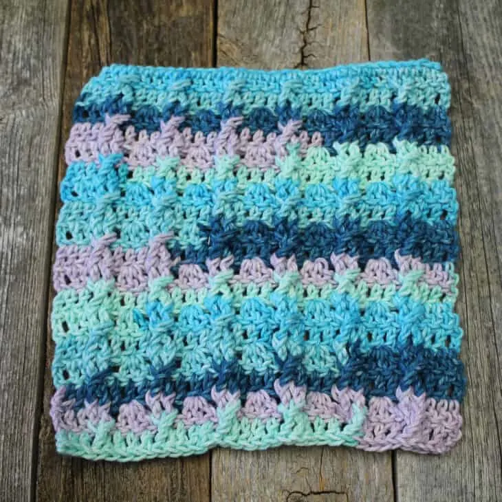 Try this easy mini cable cotton dishcloth pattern. It uses a combination of basic stitches to make this textured pattern.