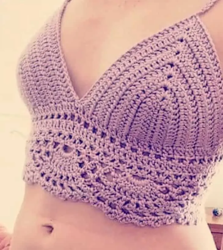 Try some summer crochet top patterns. There are lots of different tops to try.