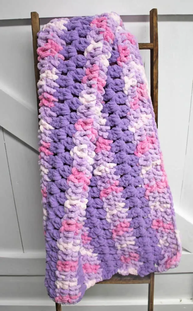 Try this easy crochet baby blanket pattern. There is a free printable PDF available. There are lots of other free blanket patterns available on amorecraftylife.com