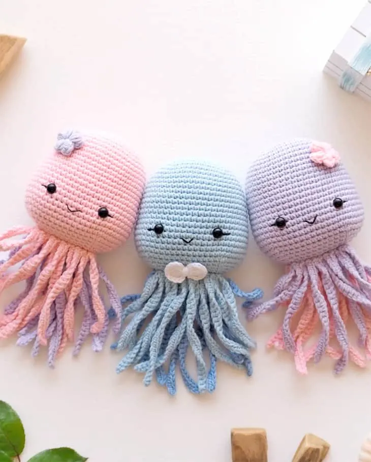 Make a cute crochet octopus. This adorable stuffed animal would make a cute baby gift. 