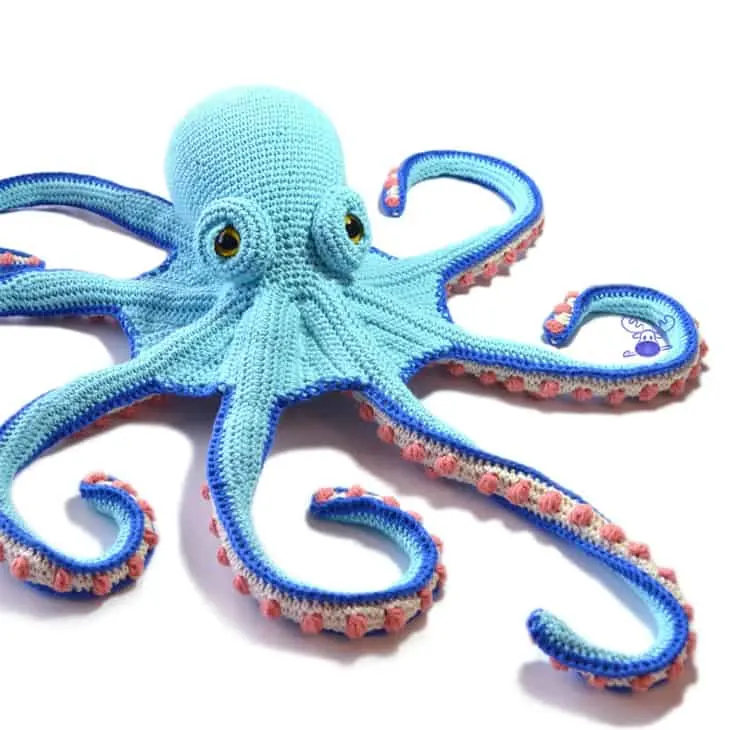 Make a cute crochet octopus. This adorable stuffed animal would make a cute gift. 