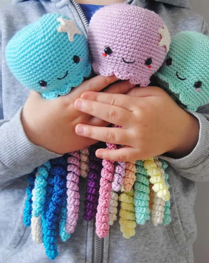 Make a cute crochet octopus. This adorable stuffed animal would make a cute baby gift. 