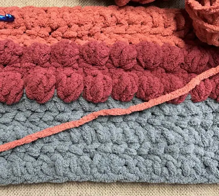 Try this easy Triple Berry Chunky Throw Pattern. This pattern uses a combination of basic stitches to make raised bobbles.