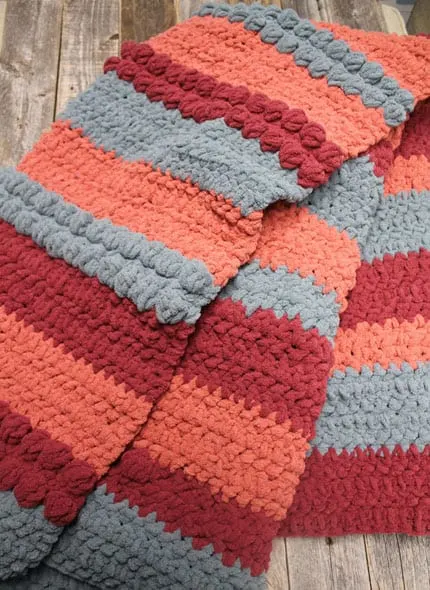 Try this easy Triple Berry Chunky Throw Pattern. This pattern uses a combination of basic stitches to make raised bobbles.