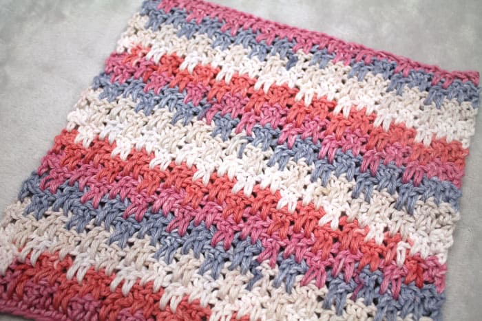 Up and down stripe washcloth crochet pattern available in a free PDF. Try this easy pattern and learn a new stitch.