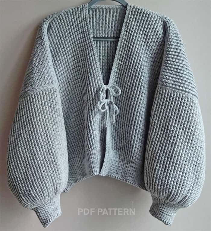 Make your own cozy pattern for a crochet cardigan. These sweaters are great for fall and winter.