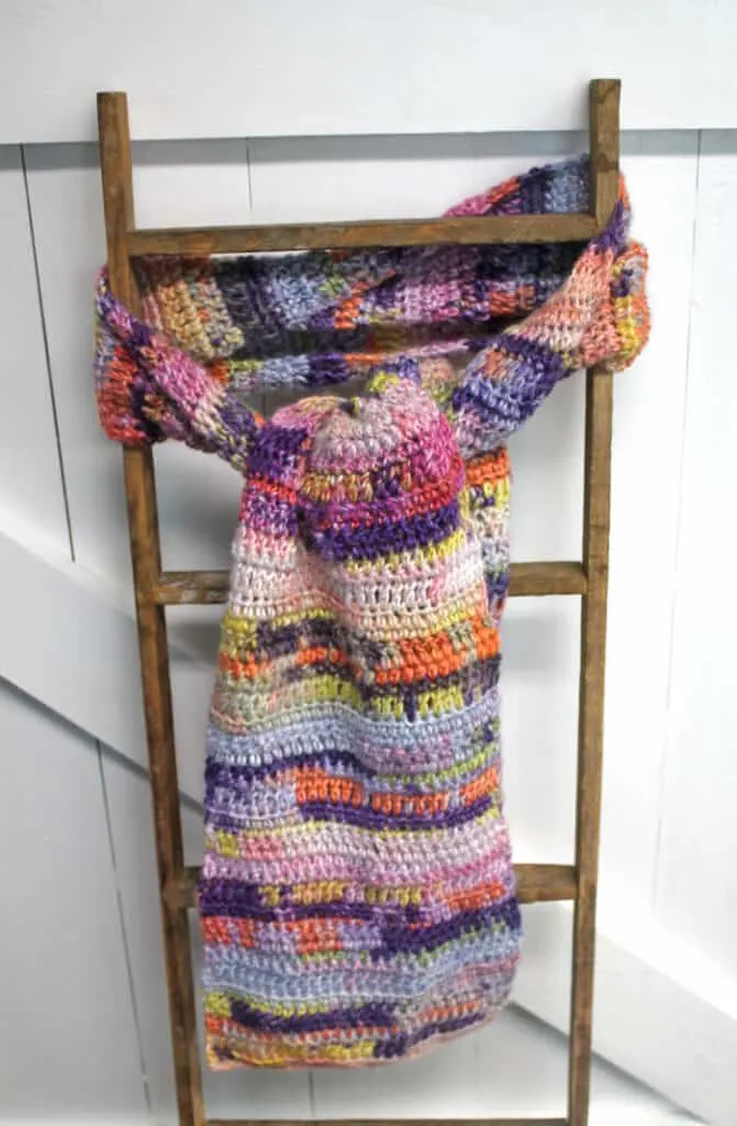 Learn how to make a basic beginner scarf with this easy crochet pattern. This colorful pattern uses basic stitches to make a fun scarf.