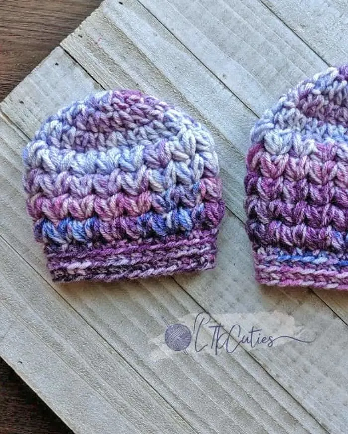 Try a cute crochet newborn hat pattern. Most patterns have several sizes from preemie to 3 month old.