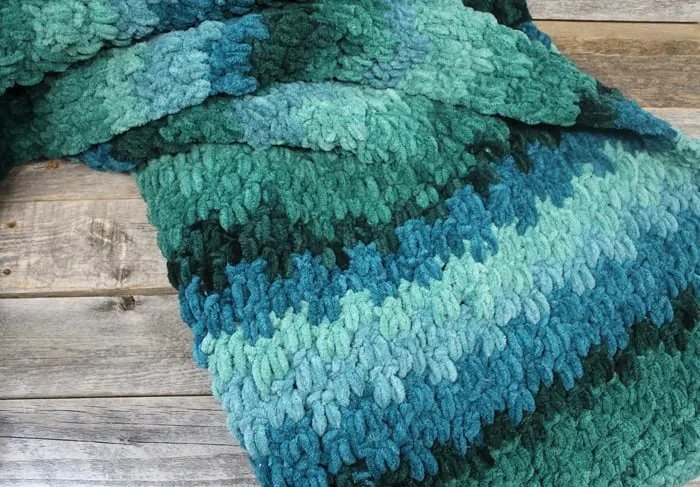 Try this easy ombre chunky throw crochet blanket pattern. This pattern uses basic stitches to make a up and down stripe pattern.