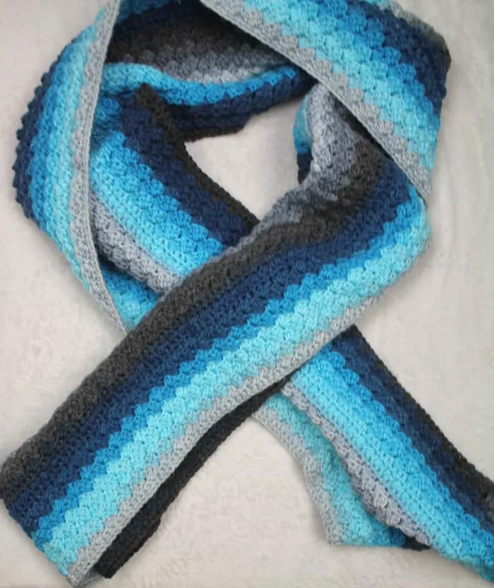 Make an easy blue striped scarf. This striped scarf is an easy repeatable crochet pattern using Lion Brand Mandala.
