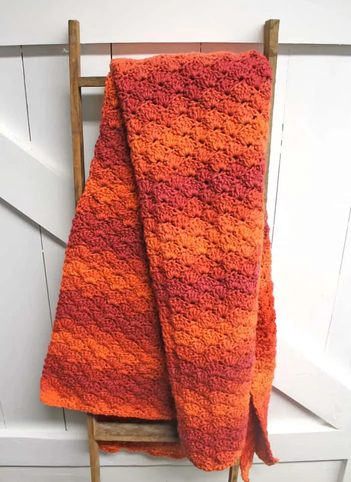Try this pretty ombre shell stripe crochet blanket pattern. There is a free easy PDF.