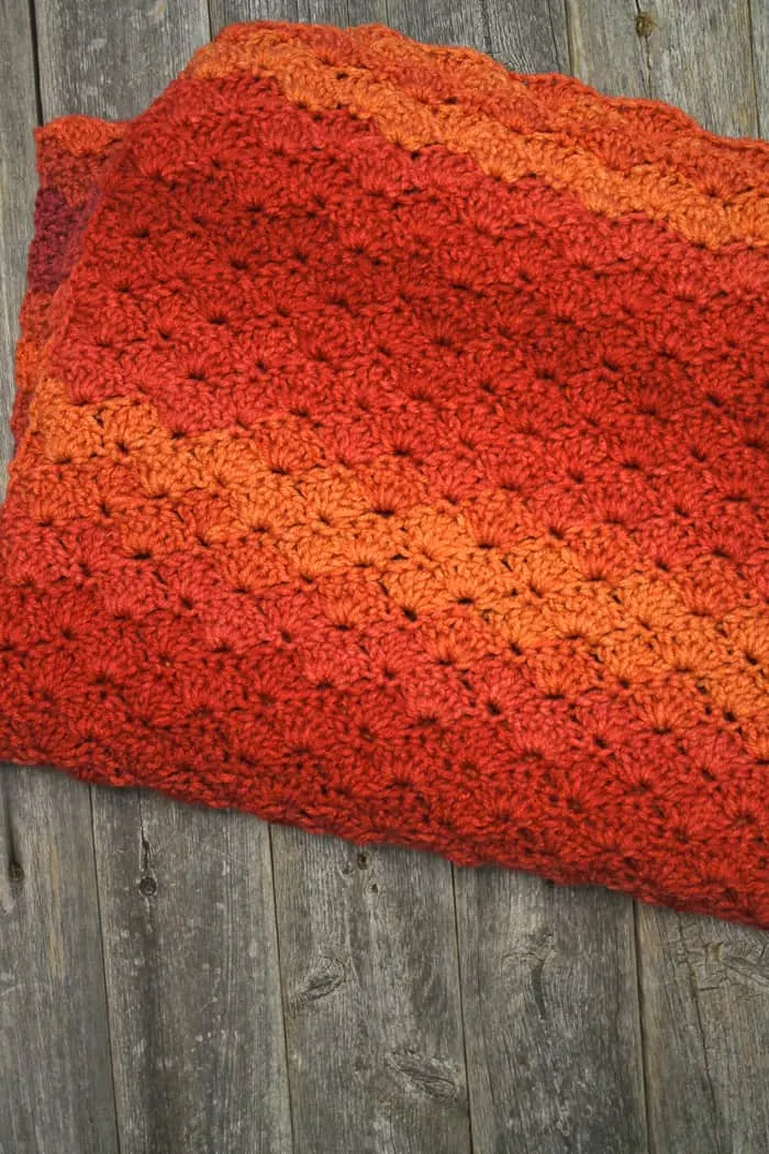 Try this pretty ombre shell stripe crochet blanket pattern. There is a free easy PDF.