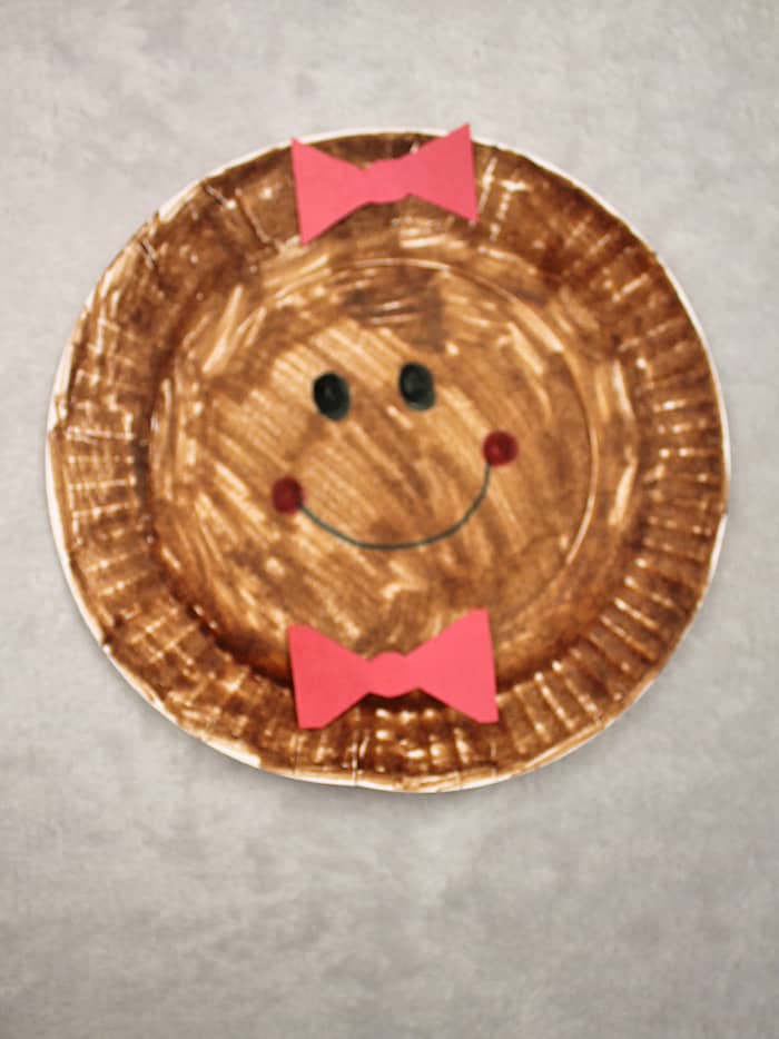 Make a cute gingerbread man Christmas ornament craft. Use a paper plate and markers to make this easy craft for kids.