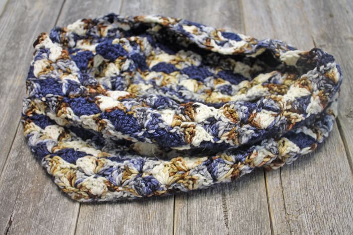 Make this pretty shell cowl crochet pattern. Look good and keep warm this winter with a free cowl crochet pattern.
