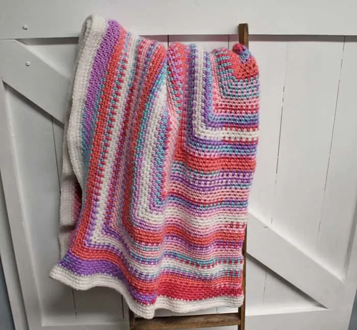 Try this easy moss stitch square blanket pattern. This free pattern is an easy combination of single crochet and chain stitches.