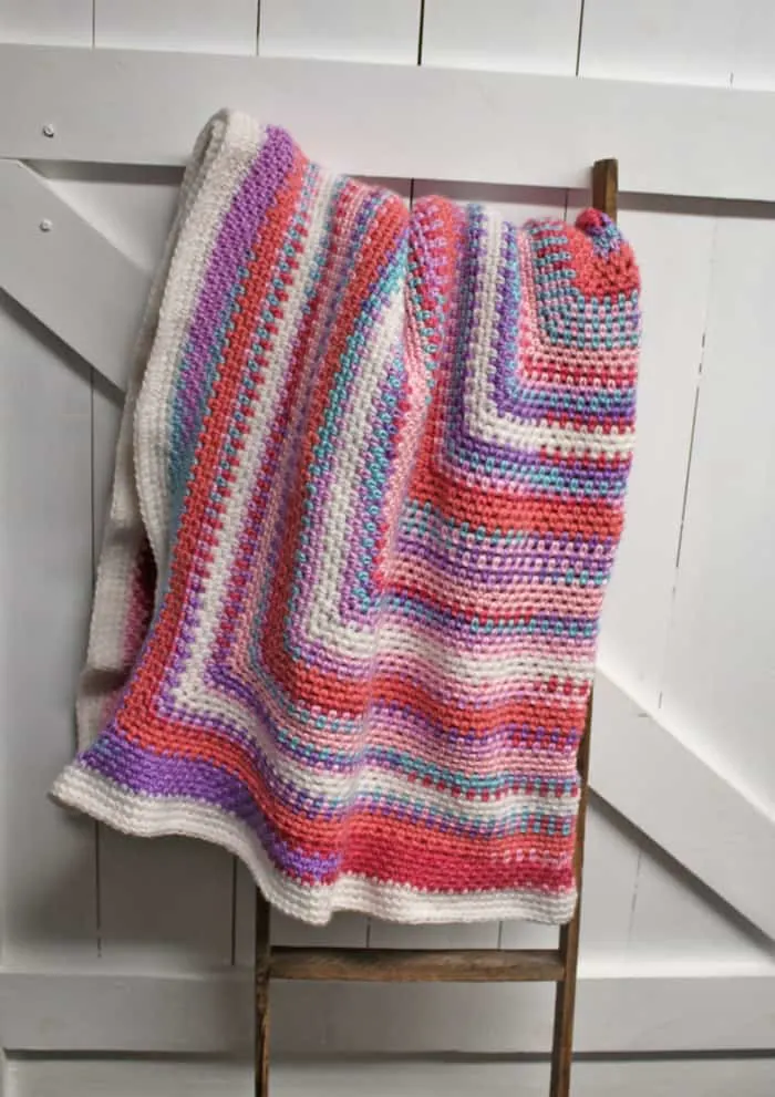 Try this easy moss stitch square blanket pattern. This free pattern is an easy combination of single crochet and chain stitches.