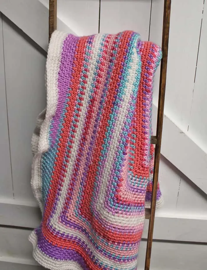 Try this easy moss stitch square blanket pattern. This free pattern is an easy combination of single crochet and chain stitches.