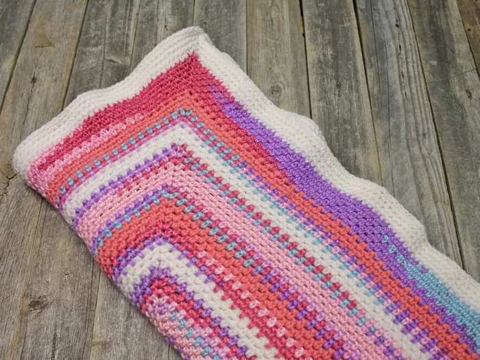 Try this easy moss stitch square blanket pattern. This free pattern is an easy combination of single crochet and chain stitches.