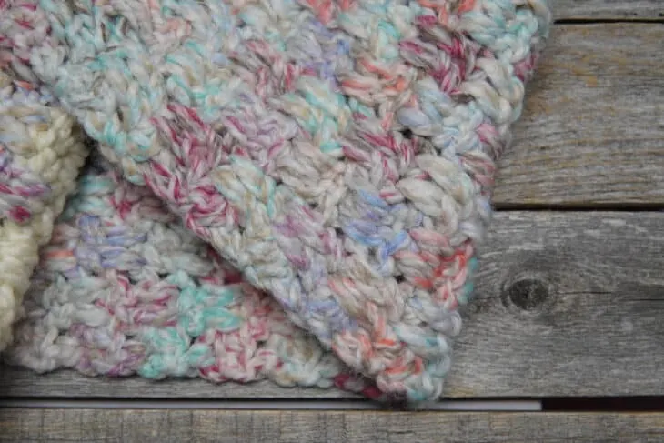 Try this chunky pocket scarf crochet pattern. This free PDF pattern uses an easy combination of double crochet stitches.