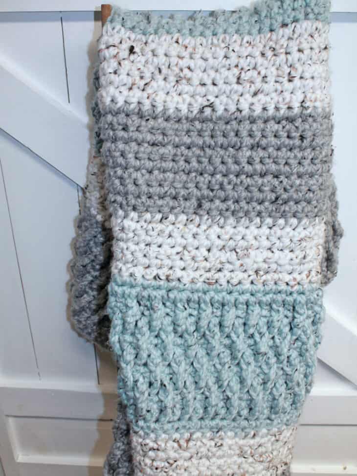 Try this super bulky tweed throw crochet pattern. This blanket uses the alpine stitch and single crochet to make a modern chunky blanket. There is a free printable PDF available.