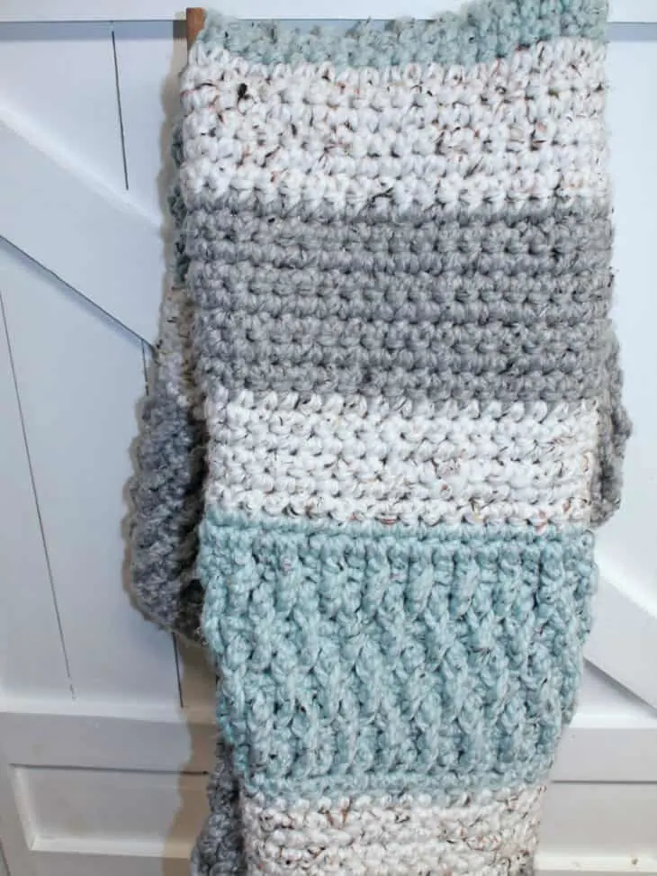 Try this super bulky tweed throw crochet pattern. This blanket uses the alpine stitch and single crochet to make a modern chunky blanket. There is a free printable PDF available.