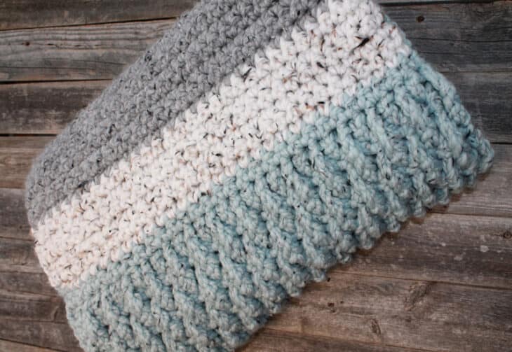 Try this super bulky tweed throw crochet pattern. This blanket uses the alpine stitch and single crochet to make a modern chunky blanket. There is a free printable PDF available.