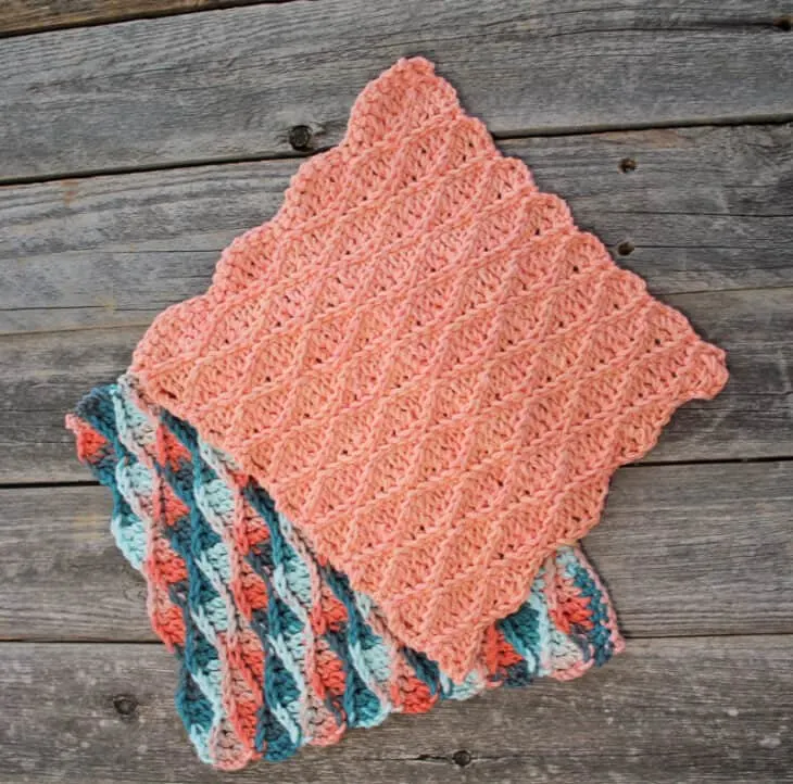 Try this raised wave dishcloth pattern. This pattern uses a repeat of basic stitches to make this eye-catching pattern. There is a free printable PDF available.