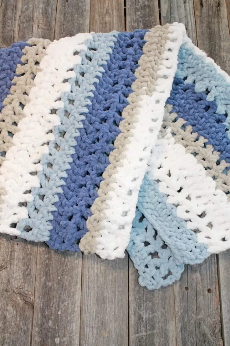 Try this chunky striped baby blanket crochet pattern. This pattern uses easy basic stitches to make a textured blanket. There is a free printable PDF available.