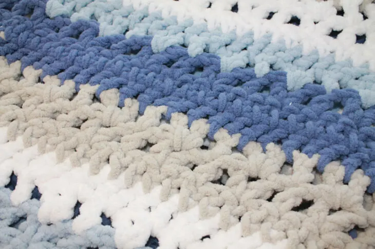 Try this chunky striped baby blanket crochet pattern. This pattern uses easy basic stitches to make a textured blanket. There is a free printable PDF available.