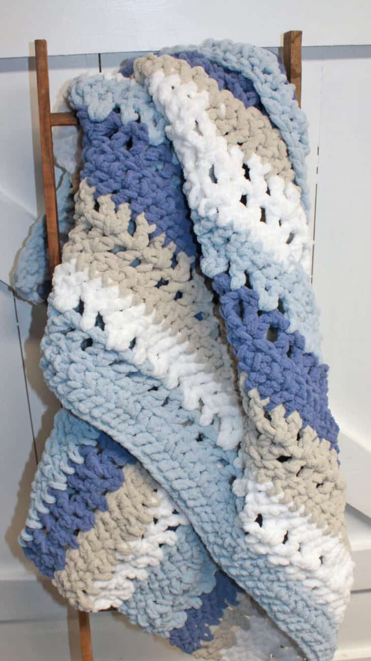 Try this chunky striped baby blanket crochet pattern. This pattern uses easy basic stitches to make a textured blanket. There is a free printable PDF available.