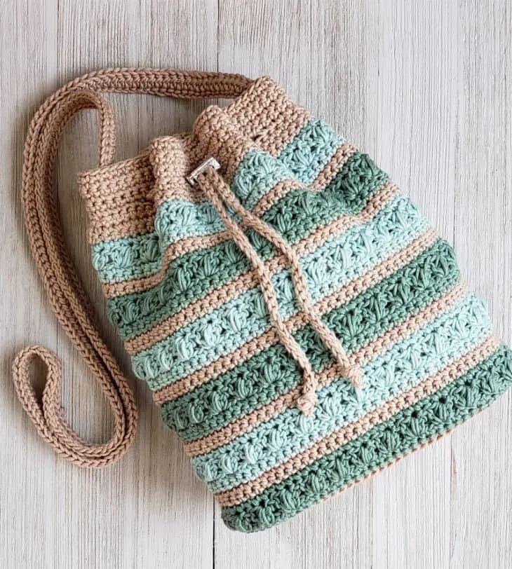 Try this pretty crochet bag pattern. Make in your favorite colors.