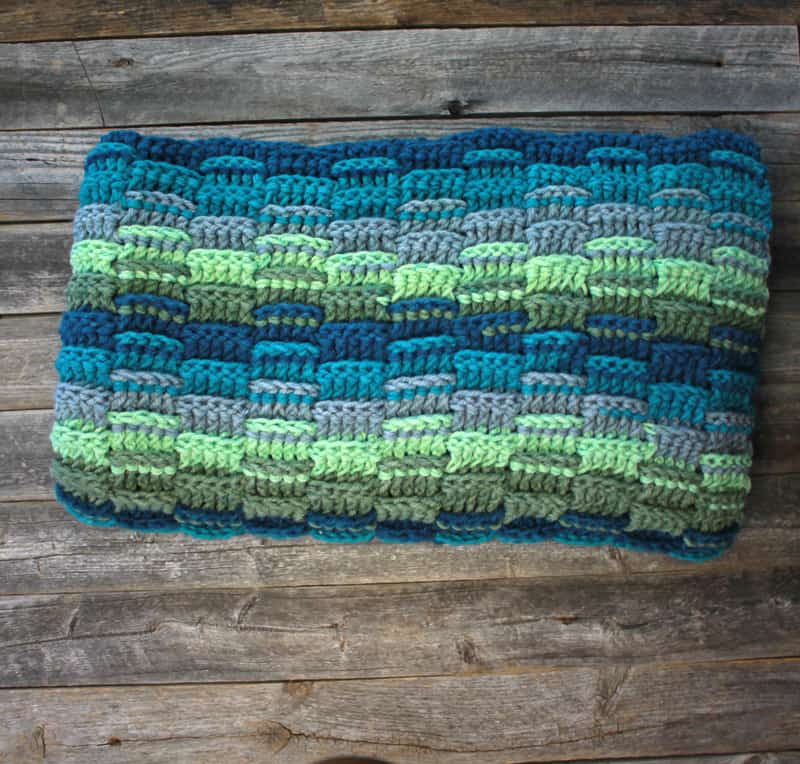 Try this easy chunky crochet throw blanket pattern. This pattern uses a variation of double crochet stitches to make a great texture. There is a free PDF pattern available.