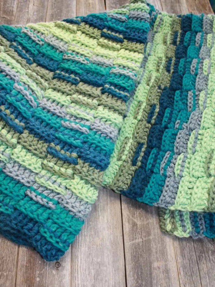 Try this easy chunky crochet throw blanket pattern. This pattern uses a variation of double crochet stitches to make a great texture. There is a free PDF pattern available.