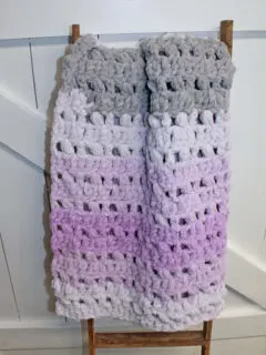 Try this pretty ombre baby blanket crochet pattern. This pattern uses the double crochet stitch and the puff stitch. There is a free printable PDF.