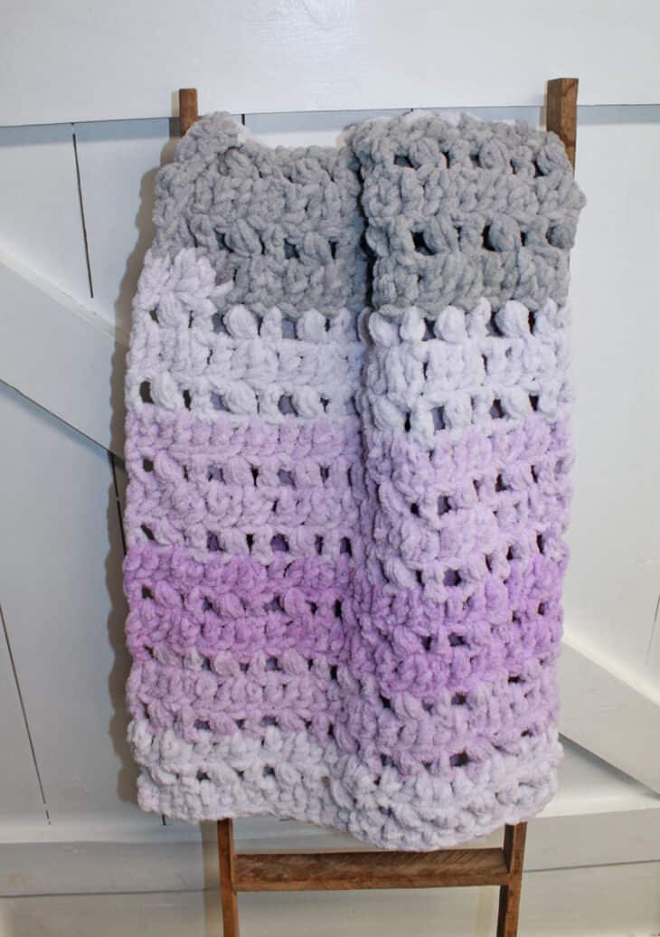 Try this pretty ombre baby blanket crochet pattern. This pattern uses the double crochet stitch and the puff stitch. There is a free printable PDF.