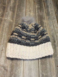 Try this bulky yarn crochet hat pattern. This hat is an quick and easy project. Make it in your favorite colors and top it with a faux fur pom pom.